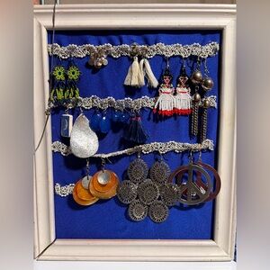 11 pair of earrings and small chain